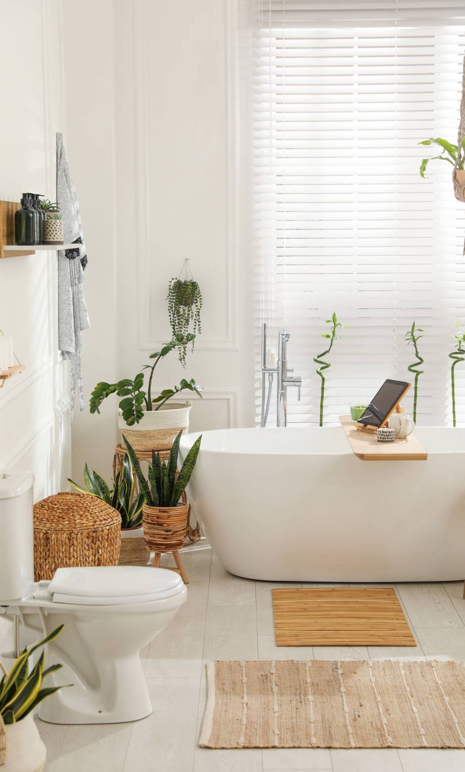 stylish-white-tub-and-green-houseplants-in-bathroo-2026-01-28-19-00-12-utc